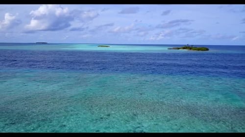 Aerial top view seascape of idyllic lagoon beach trip by blue lagoon and white sandy background of a