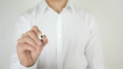 Man Writes the Word Invest on a Screen