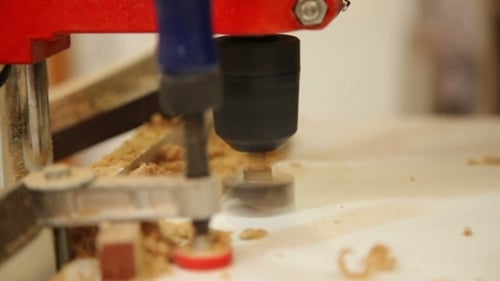 Woodworking Machine Drilling Through Wood Material