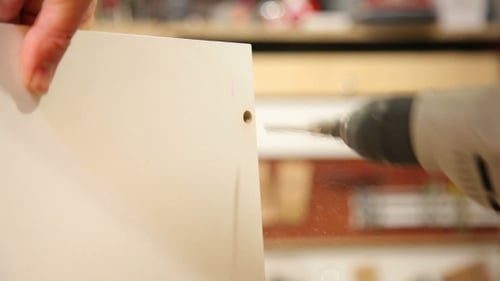 Worker Handles a Wooden Board