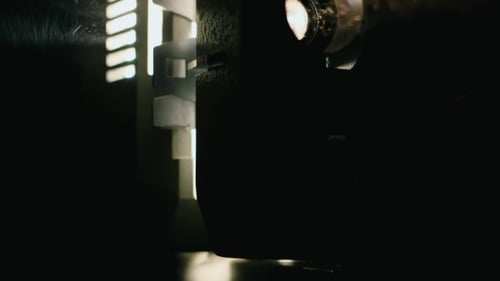 Vintage Film Projector in Operation During Night