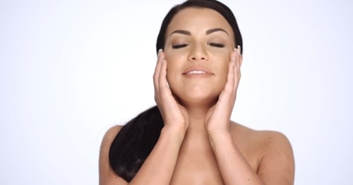 Woman Massaging Face for Skincare Beauty Routine