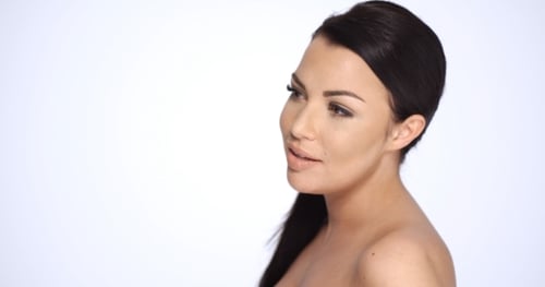 Attractive Young Woman Posing in Studio Setting