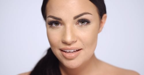 Woman Smiling In a Close Up Beauty Shot