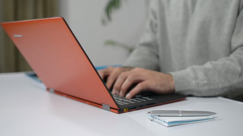 Young Designer Working on New Design on Laptop