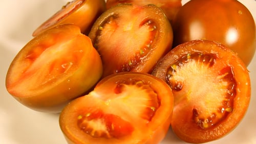 Close-up of Fresh Tomatoes on White Plate