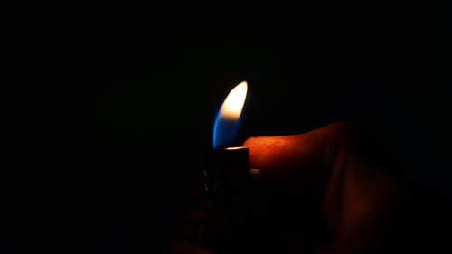 Close Up Flame of a Lighter in Dark