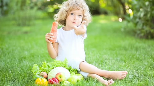 Child Enjoys Carrot with Vegetables and Fruit