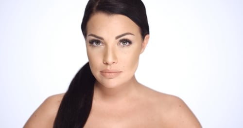 Serious Woman Posing for Portrait on White