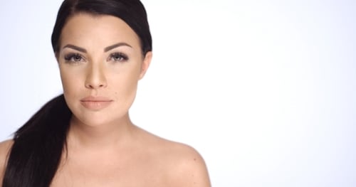 Close-Up of Woman with Dark Hair on White