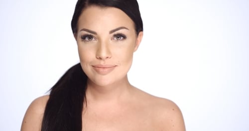 Close Up of Smiling Young Woman in Studio