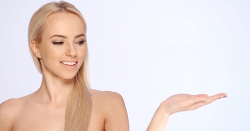 Beautiful Blonde Woman Presenting Product with Open Palm
