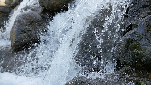 Water Cascading Down Rocky Waterfall