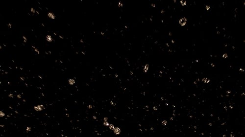 Animated Golden Particles Falling on Dark Background