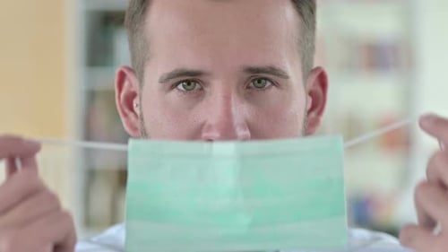 Close Up of Young Man Wearing Face Mask