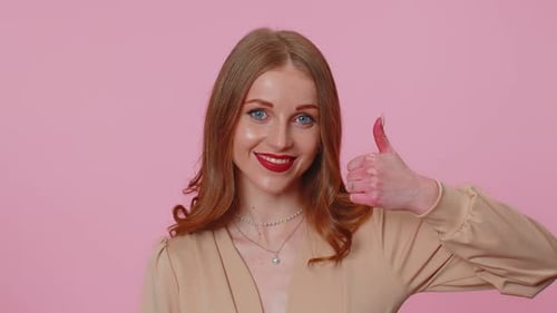Smiling Woman Gives Thumbs Up Approval