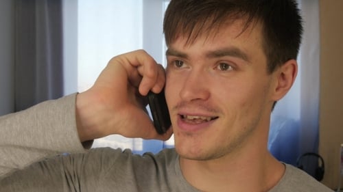 Young Adult Male Talking on Cellphone Close Up