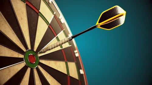Darts arrow hitting in the bullseye of the dartboard hanging on the dark wall.
