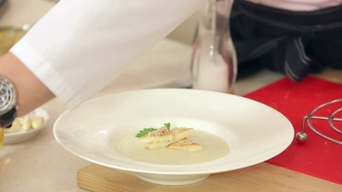 Adding Herbs to Soup with Croutons