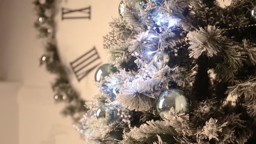 Festive Christmas Tree with Blue Ornaments Indoors
