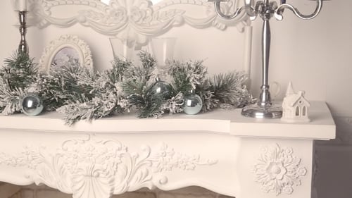 Festive Christmas Decor on Elegant White Fireplace Mantel