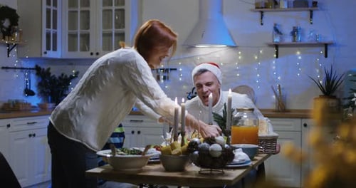 Family Celebrating Christmas Dinner at Home