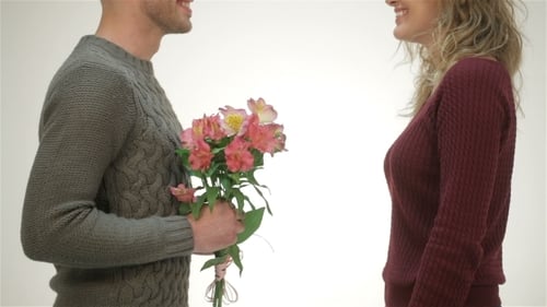 Romantic Man Giving Bouquet of Flowers to Woman