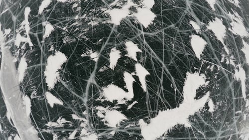 Frozen Lake Covered With a Thick Layer of Ice 3
