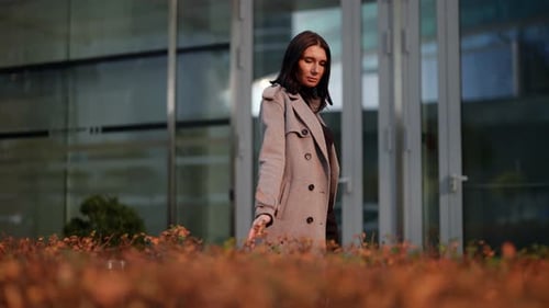 Autumn Walk in City Center Successful Woman is Walking in Business District in Daytime