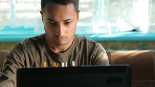 A Man Works With Laptop