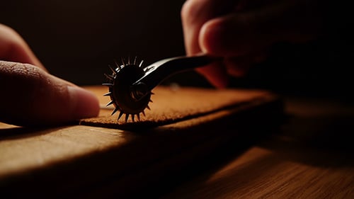 Tracing Wheel Tool on Leather Piece Close Up
