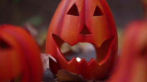 Autumn Jack-O-Lanterns with Candles and Leaves