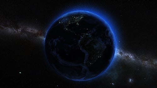Rotating Earth at Night with Glowing Blue Atmosphere