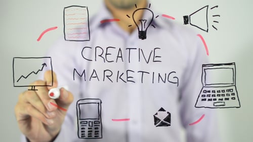 Creative Marketing Idea Being Drawn on Glass