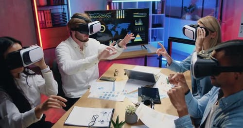 Team Wearing VR Headsets in Modern Office