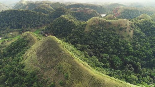 Rise-up Aerial Green Grass Hills Top and Ranges View at Mayon Town, Philippines, Asia