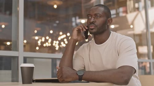 Young Adult Using Smartphone, Talking on Phone