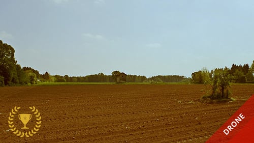 Flight Over Plowed Field