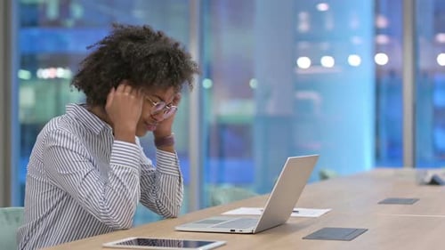 Loss, African Businesswoman Reacting To Failure on Laptop in Office