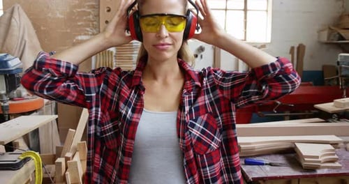 Woman Wearing Safety Gear Gives Two Thumbs Up