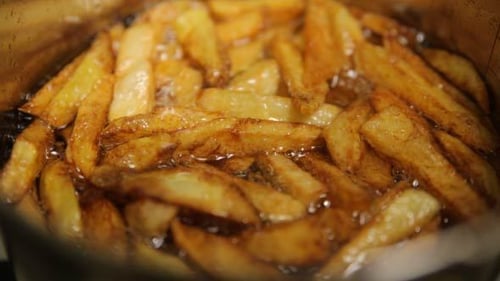 French Fries Cooking In Oil