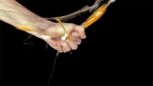 Hand Crushing An Egg
