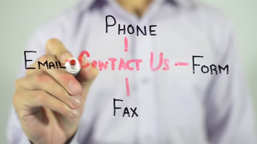 Hand Writing Contact Us on Glass Screen