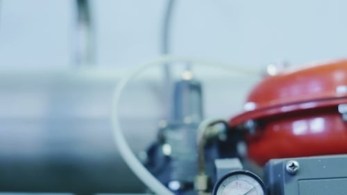Industrial Machine with Gauges and Pipes Close Up