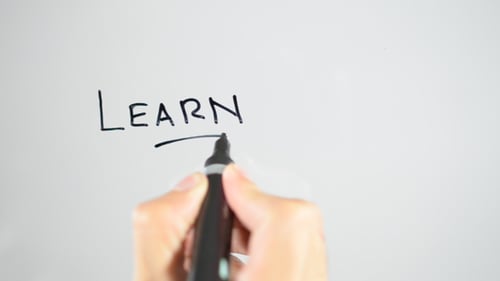 Writing the Word Learn on a Whiteboard