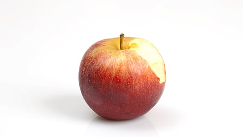 Red Apple Bites Time Lapse on White Surface