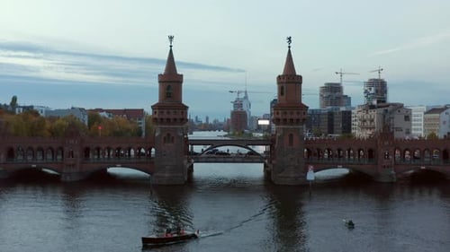 Aerial Establishing Shot of Through 2 Towers of Oberbaum Bridge in Berlin, Germany Revealing Skyline