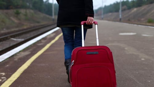 Girl at the Train Station Waiting for a Train