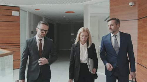 Team of Lawyers Walking through Office