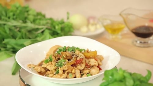 Delicious Chicken Stir-Fry in a White Bowl